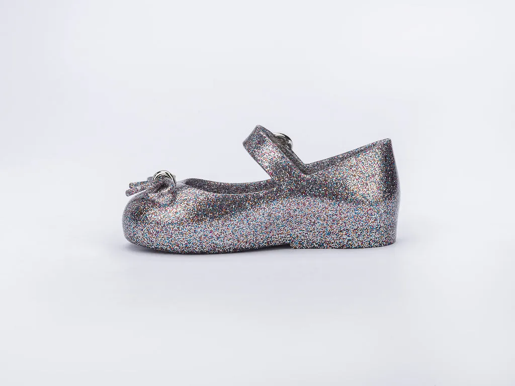 Certainly! Heres an optimized title for your product:

Adorable Baby Girls Silver Glitter Sandals with Bow Applique - Mini Melissa Sweet Love